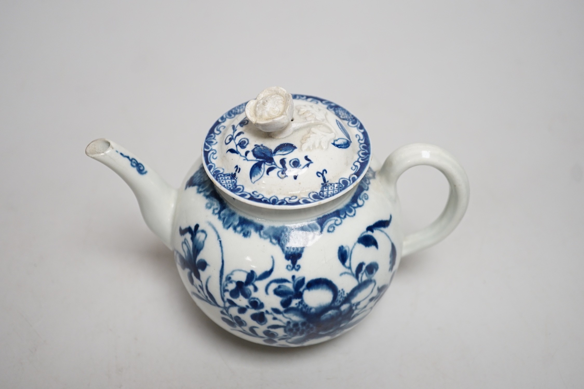 A Worcester Mansfield pattern teapot and cover with flower decoration and finial. 13cm tall